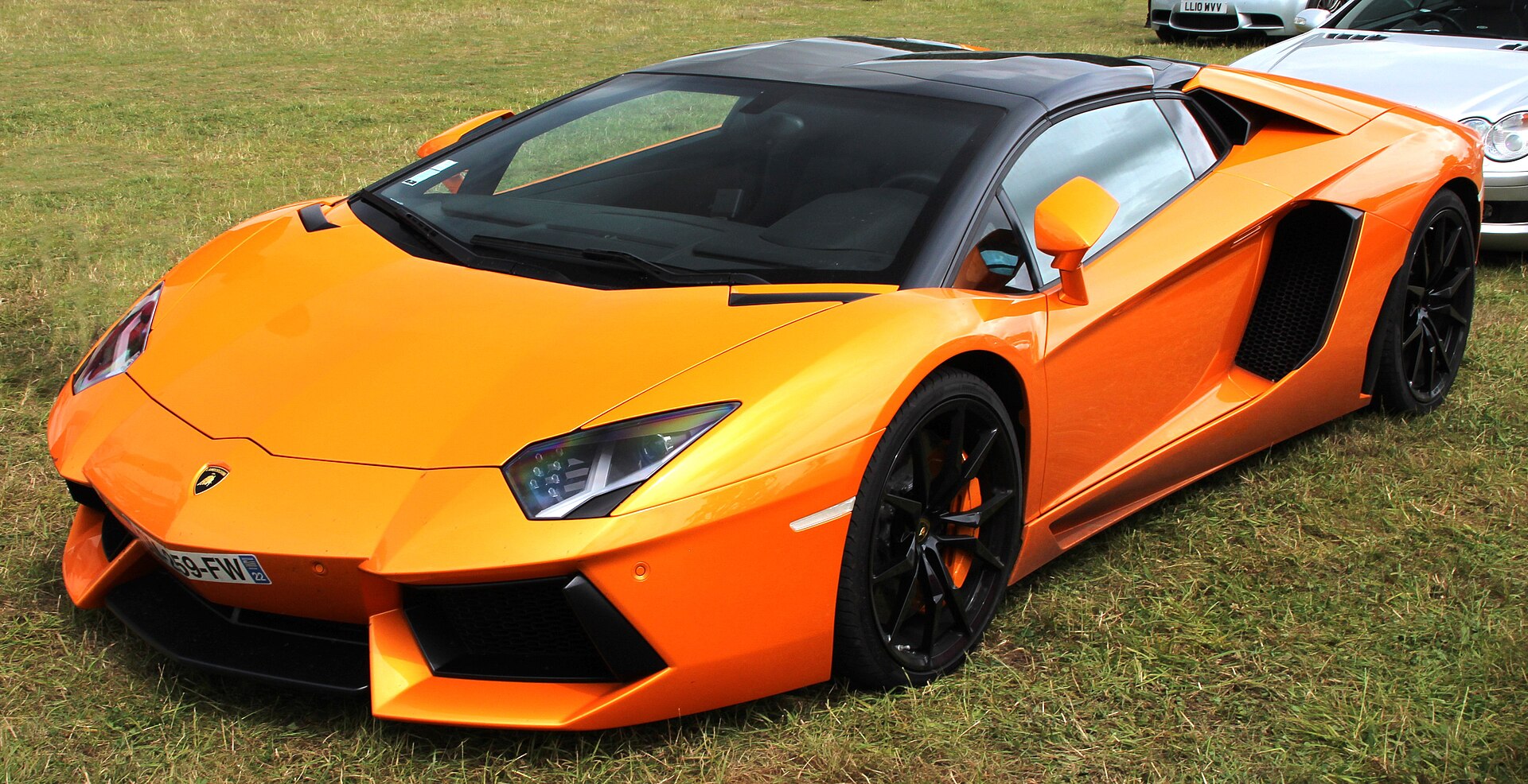 Orange Lamborghini Aventador as a stand-in for the Huracán class